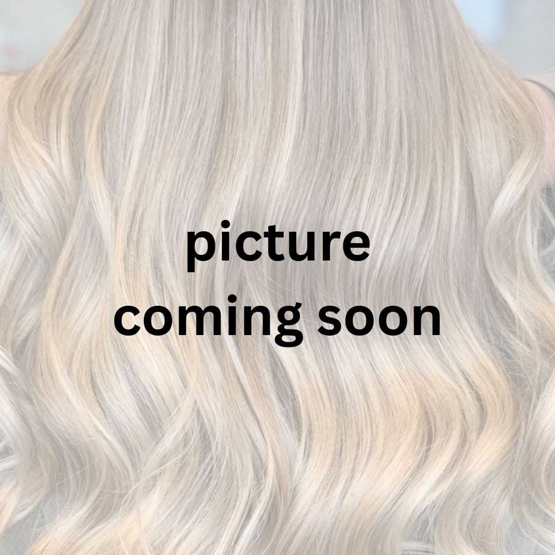 Portrait of Tim Buckley, a professional stylist at Lux Hair Designs, showcasing their expertise and style.